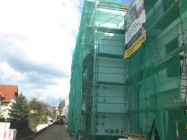 Wykonywanie elewacji zewnętrznej i tynków wewnętrznych, wykonanie prac w 60%